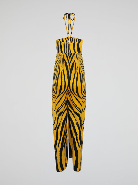 Unleash your wild side with the Animal Print Halter Neck Jumpsuit by Roberto Cavalli. This fierce and daring ensemble embraces the untamed spirit of the jungle, featuring a striking leopard print that demands attention. With its seductive halter neck and flattering silhouette, this jumpsuit is the perfect choice for those who aren't afraid to make a fashion statement.
