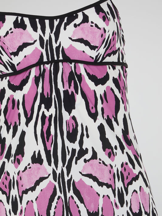 Unleash your wild side with the Animal Print Strap Dress by Roberto Cavalli. This captivating and daring dress features a mesmerizing print that evokes the untamed spirit of the jungle. The sleek and flattering silhouette, coupled with the luxurious fabric, makes it a fierce and fashionable choice for any occasion.