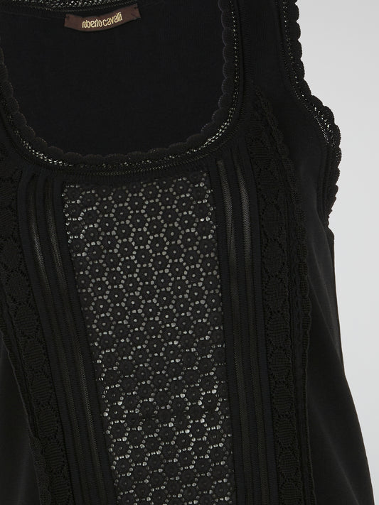 Introducing the exquisite Black Lace Trim Top by Roberto Cavalli, a true embodiment of elegance and sophistication. Crafted with meticulous attention to detail, it features delicate lace detailing that adds a touch of femininity to the classic black design. Whether paired with tailored pants or a flowing skirt, this timeless piece is bound to turn heads and make a lasting impression.