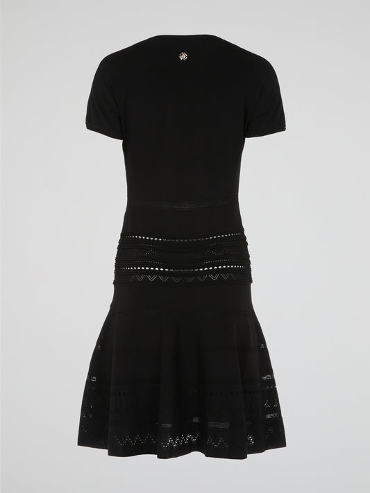 Get ready to turn heads in this stunning Black Studded Flared Dress by Roberto Cavalli. With its edgy studded detailing and flared silhouette, this dress exudes high-octane glamour. Perfect for a night out or any special occasion, it's the ultimate statement piece for those who dare to stand out from the crowd.
