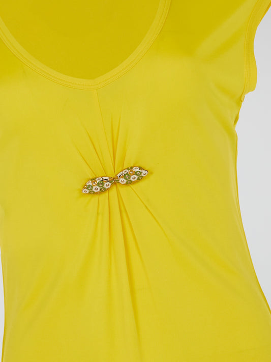 Make a bold statement with the Yellow Cap Sleeve Top by Roberto Cavalli, where vibrant sunshine meets high fashion finesse. Crafted with premium quality and attention to detail, its cap sleeves add a touch of playful elegance to any outfit. Embrace your inner fashion icon as you confidently step out, turning heads and radiating pure glamour.