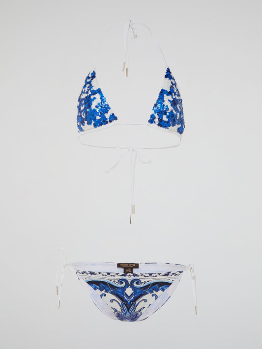 Dive into luxury and make a bold fashion statement with the Blue Embellished Swimwear by Roberto Cavalli. This exquisite piece showcases the perfect blend of elegance and glamour, with its intricate embellishments that effortlessly catch the sunlight and steal the spotlight. Whether lounging by the poolside or frolicking on sandy beaches, this swimwear will transform you into a true beach goddess.