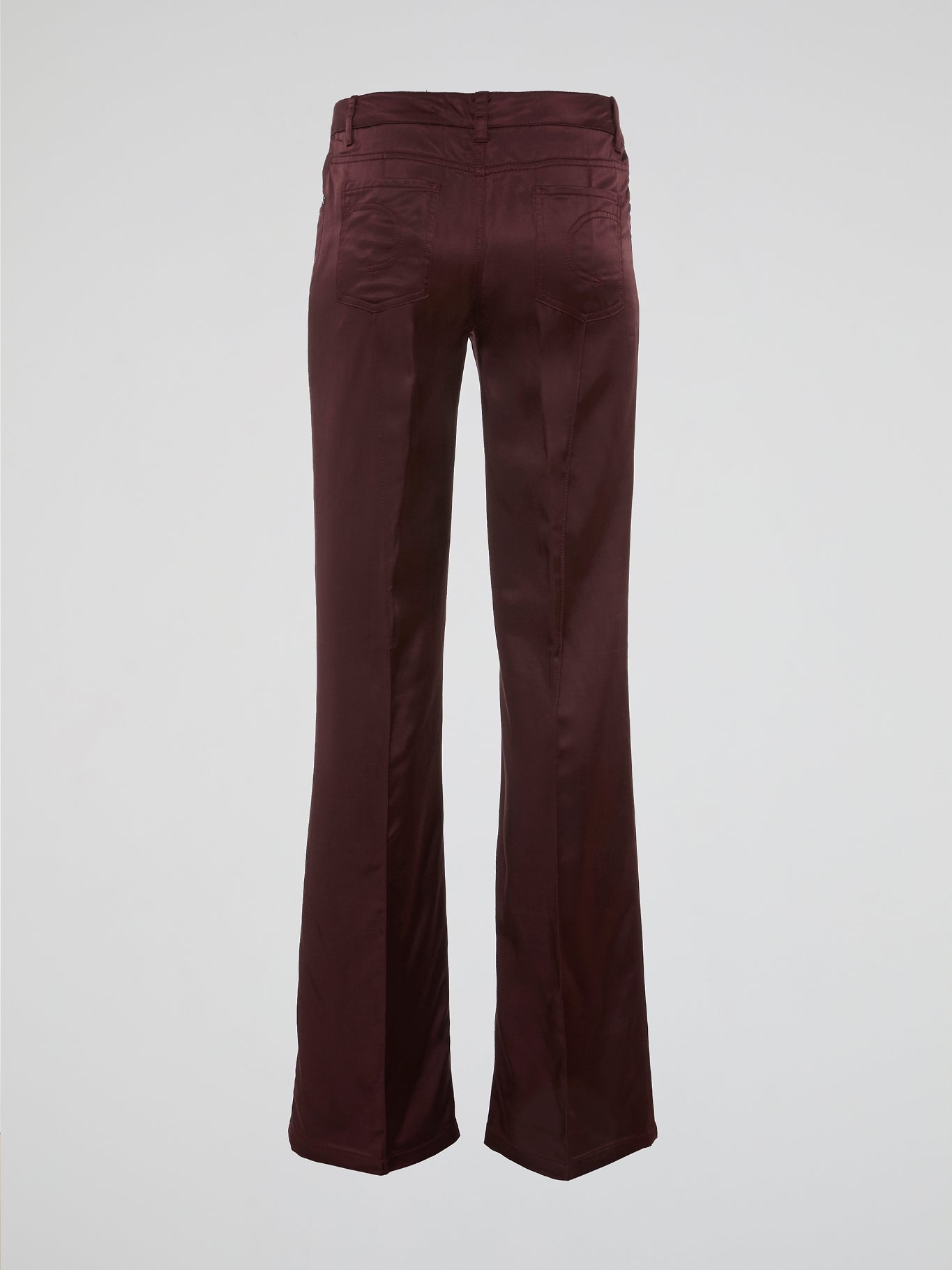 Step up your fashion game with these Burgundy Flared Pants by Clas Roberto Cavalli. Crafted from luxurious materials, these pants offer a sleek and chic silhouette with a touch of retro flair. Perfect for both formal and casual occasions, they effortlessly elevate any outfit, making you the style icon wherever you go.