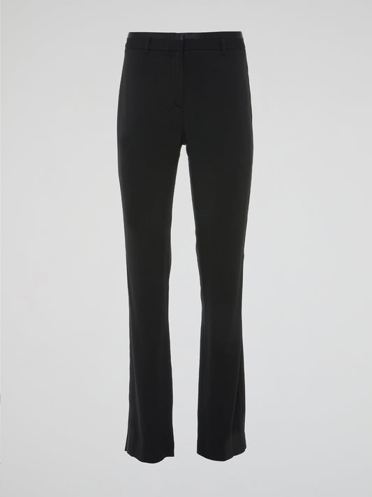 Step up your fashion game with these black high-waist flared pants by Roberto Cavalli. Crafted with impeccable craftsmanship and a touch of glamour, these pants exude elegance and style. Whether you are hitting the dance floor or a fancy dinner party, these pants will effortlessly flatter your figure and make heads turn.