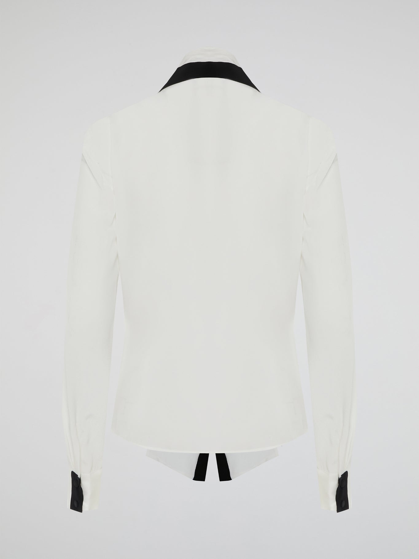Introducing the White Contract Detailed Shirt by Emanuel Ungaro - a symphony of sophistication and style. Crafted with meticulous attention to detail, this shirt embodies elegance with its intricate contract stitching, adding a touch of modernity to a classic design. Perfect for the discerning gentleman who seeks to make a bold and refined statement, this shirt is the epitome of luxury fashion.
