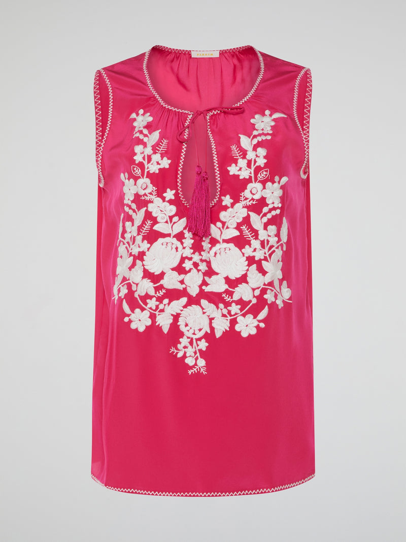 Step into a blooming sanctuary of style with our Pink Floral Embroidered Top by Parosh. Delicately crafted with love, vibrant embroidery dances across the fabric, transforming this ordinary top into a work of wearable art. As you slip it on, you'll instantly feel like you're strolling through a lush garden, ready to turn heads and embrace your inner flower goddess.