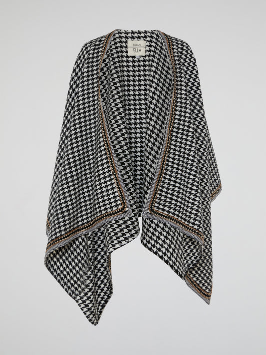 The Houndstooth Embellished Poncho by Ella Luna is the perfect blend of classic and contemporary style. Crafted with meticulous attention to detail, this luxurious poncho features a mesmerizing houndstooth pattern that instantly elevates any outfit. Its elegant embellishments add a touch of glamour, making it a must-have statement piece for every fashion-forward individual.