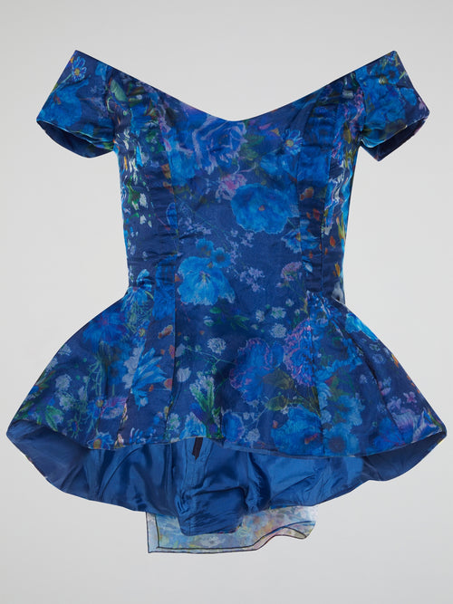 Introducing the Blue Floral Peplum Top from Io Couture, an absolute must-have for fashion-forward individuals! With its vibrant blue hue and stunning floral print, this top effortlessly combines elegance and femininity. The flirty peplum silhouette adds a playful twist, making it perfect for both casual brunches and glamorous evenings out.