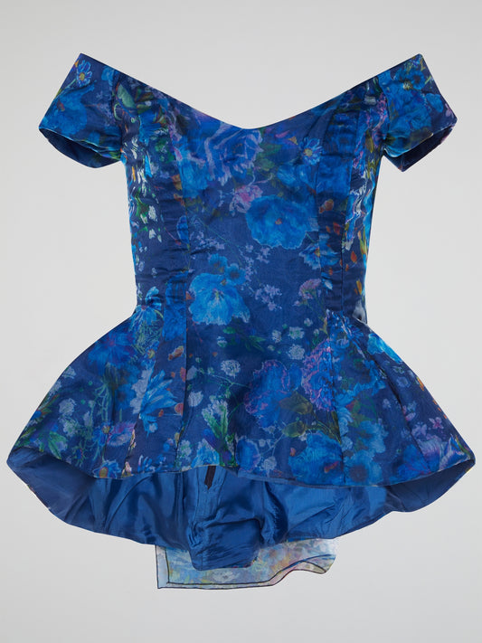 Introducing the Blue Floral Peplum Top from Io Couture, an absolute must-have for fashion-forward individuals! With its vibrant blue hue and stunning floral print, this top effortlessly combines elegance and femininity. The flirty peplum silhouette adds a playful twist, making it perfect for both casual brunches and glamorous evenings out.