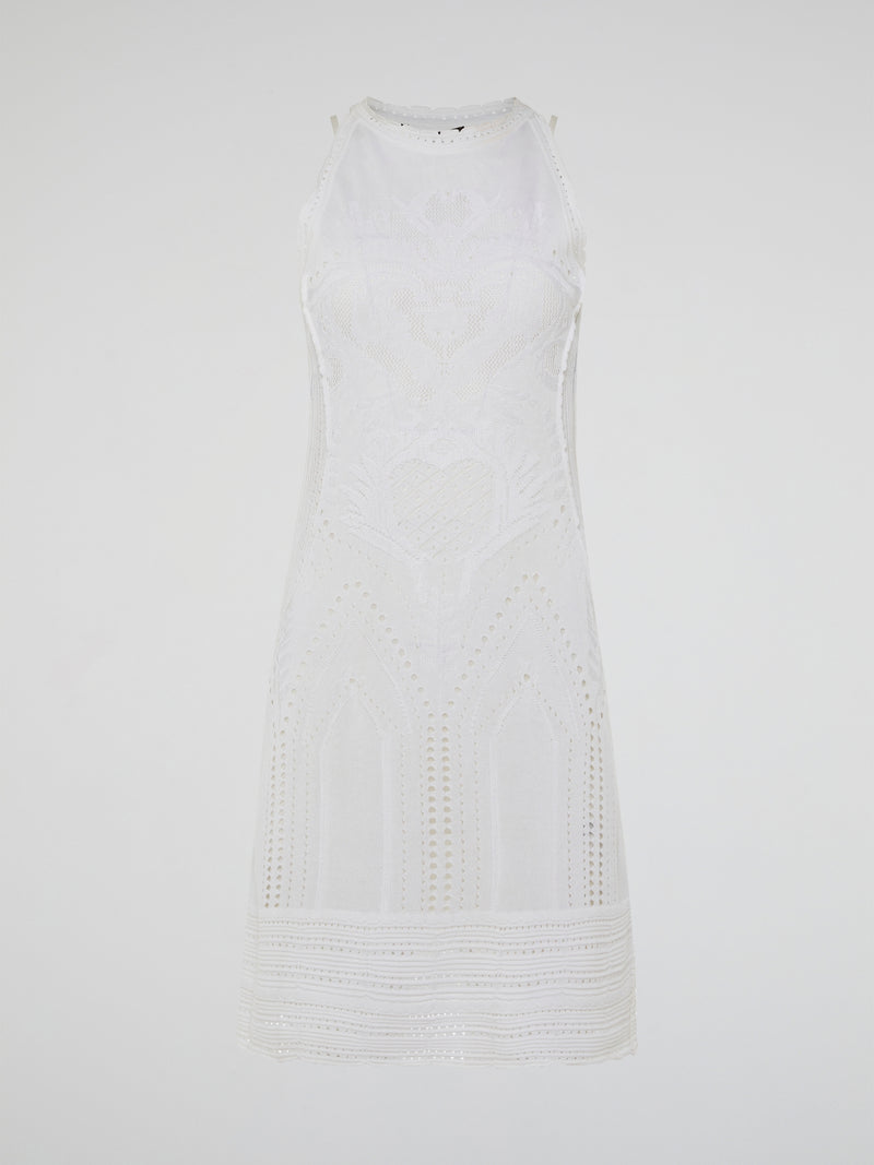 Dance into shimmering moonlit nights in the ethereal beauty of the White Knitted Sleeveless Dress by Roberto Cavalli. Crafted with meticulous artistry, this exquisite dress features delicate knitted patterns that seamlessly cascade down your curves, creating an enchanting silhouette. With its timeless elegance and romantic charm, this dress is a masterpiece that exudes pure grace and allure.