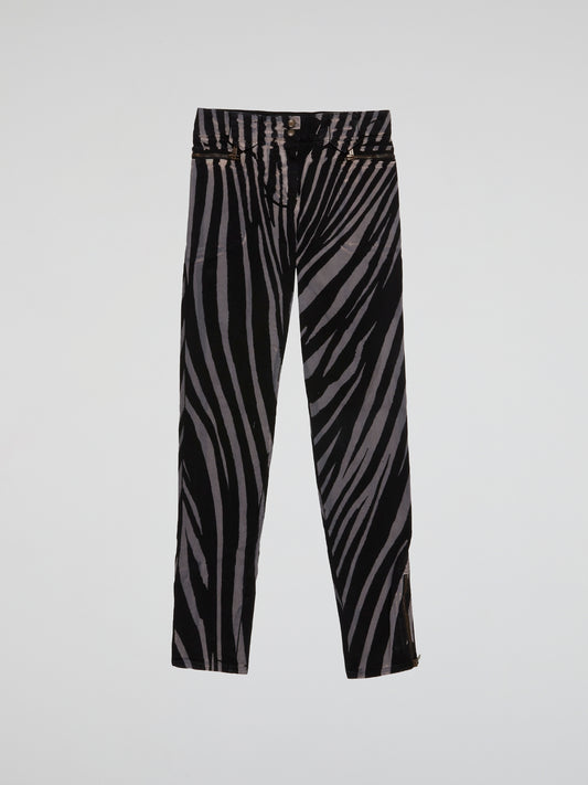 Step into the wild side with these Zebra Print Trousers by Roberto Cavalli and let your fashion roar! Crafted from luxurious fabric, these trendy trousers feature the iconic zebra print, adding a touch of untamed elegance to your wardrobe. Whether paired with a bold blazer or a simple blouse, these trousers are bound to make a fierce fashion statement wherever you go.