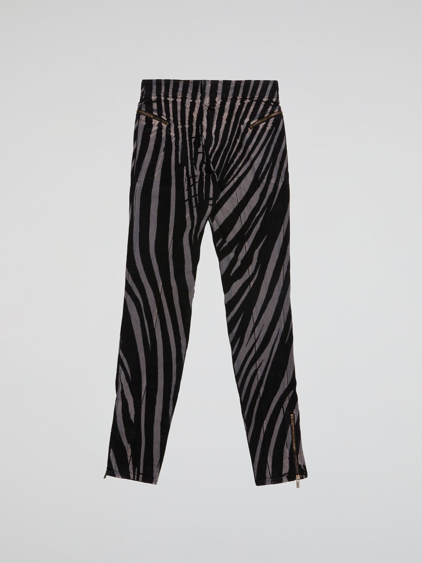 Step into the wild side with these Zebra Print Trousers by Roberto Cavalli and let your fashion roar! Crafted from luxurious fabric, these trendy trousers feature the iconic zebra print, adding a touch of untamed elegance to your wardrobe. Whether paired with a bold blazer or a simple blouse, these trousers are bound to make a fierce fashion statement wherever you go.