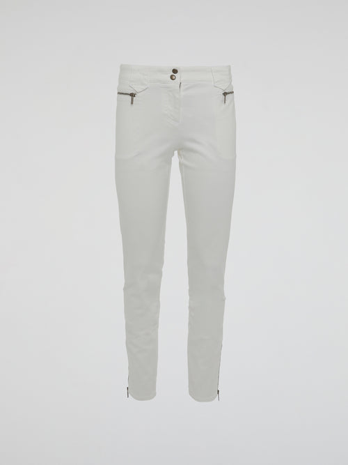Introducing the epitome of style and sophistication - the White Zipper Detailed Trousers by Roberto Cavalli. These exquisite trousers blend modern minimalism with edgy details, boasting a sleek white hue that exudes elegance. The alluring zipper accents strategically placed throughout add a touch of rebellious charm, making these trousers a true fashion statement.
