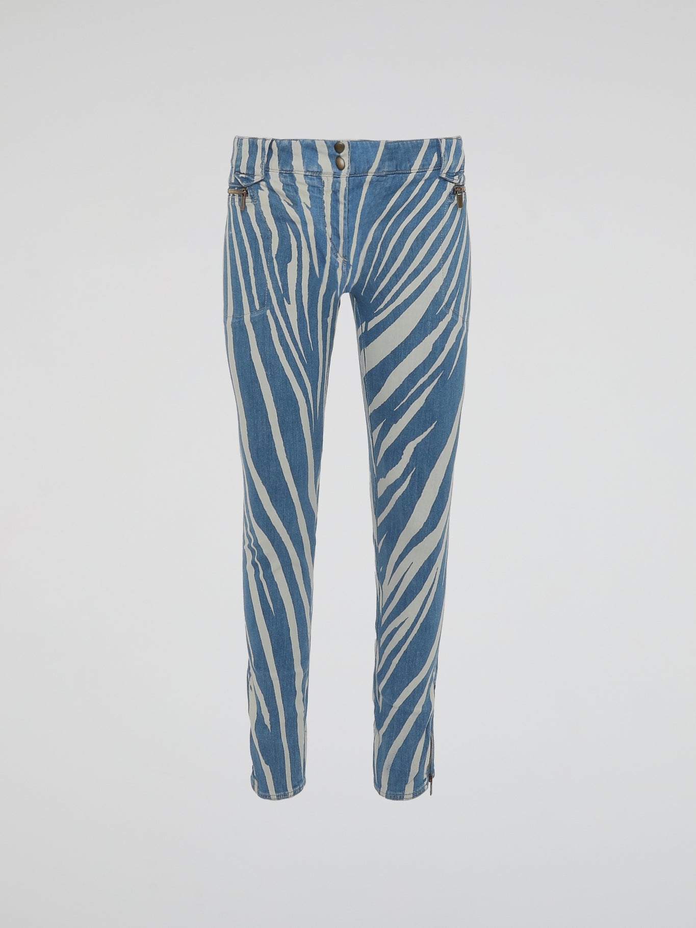 Unleash your inner wild child with our Roberto Cavalli Zebra Print Skinny Jeans. Made from high-quality denim, these jeans embrace the perfect combination of fierce and fashionable. Stand out from the crowd and embrace your unique style with these eye-catching and adventurous bottoms.