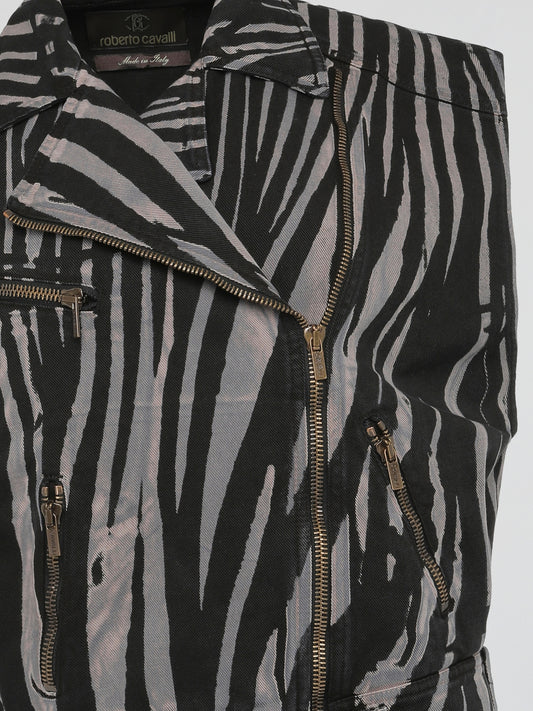 Step into the wild side of fashion with the mesmerizing Zebra Print Sleeveless Jacket by Roberto Cavalli. This avant-garde masterpiece effortlessly combines the untamed spirit of zebras with the sophistication of Italian craftsmanship. With its bold monochromatic stripes and impeccable tailoring, this statement piece will make heads turn and hearts skip a beat wherever you go.