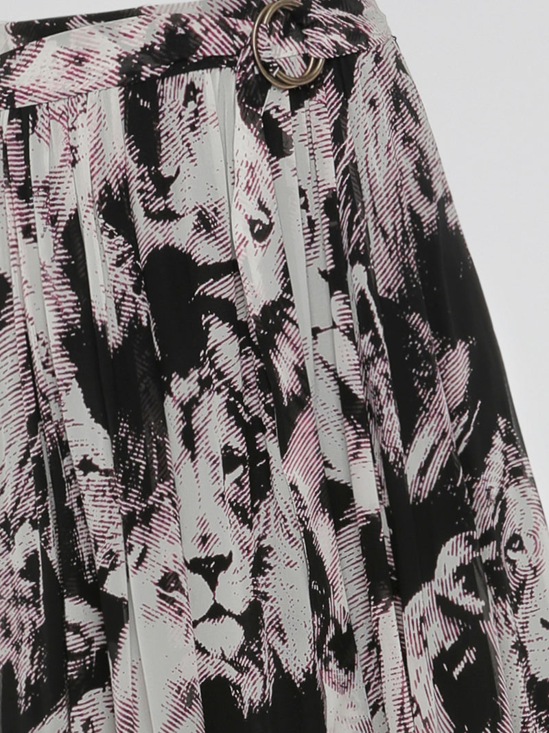 Step into the wild side with the Animal Print Pleated Maxi Dress by Roberto Cavalli. This captivating dress features a mesmerizing animal print pattern that embodies fierceness and elegance. Its pleated design effortlessly flows with every step, creating a striking silhouette that will make heads turn wherever you go.