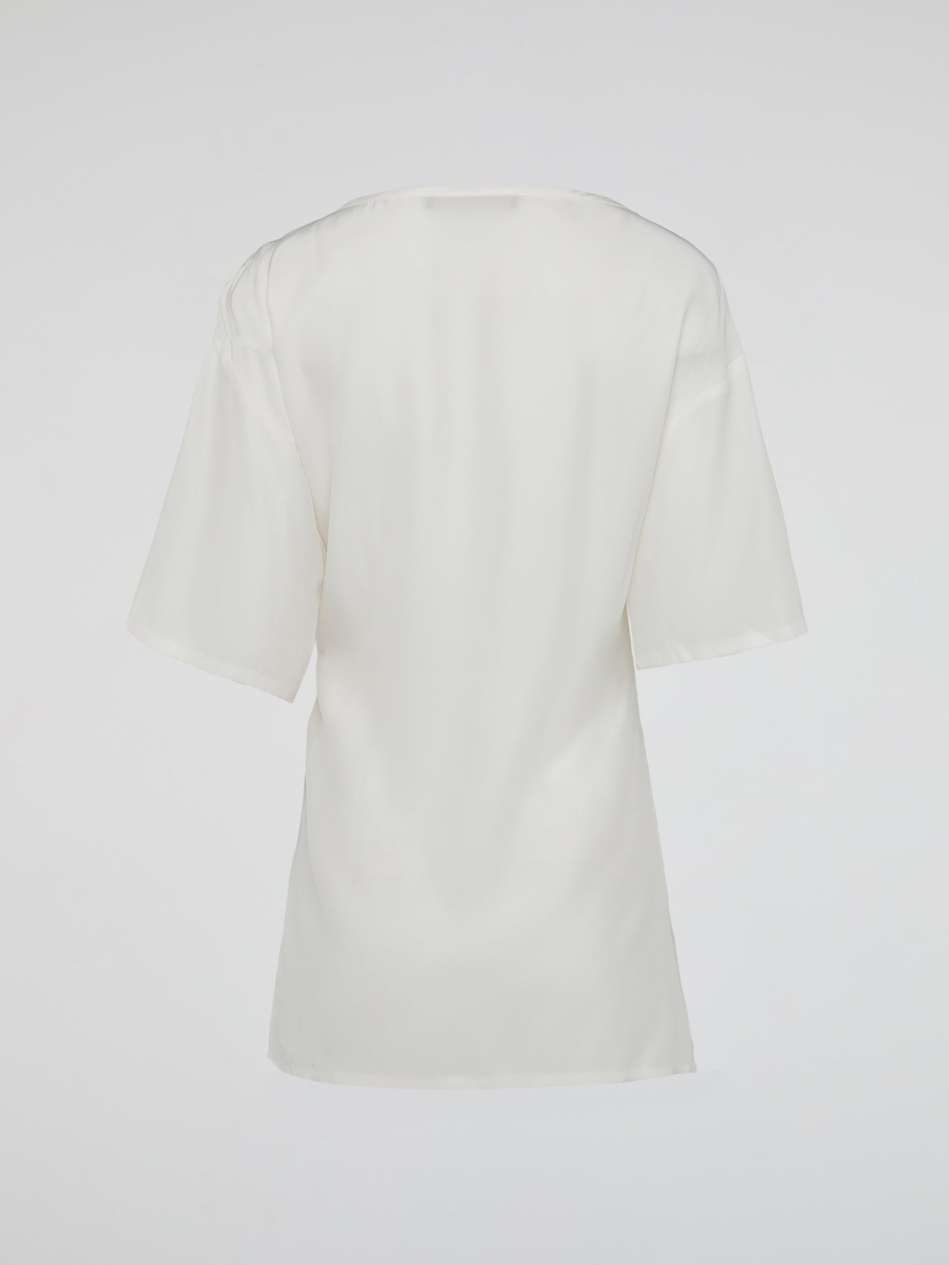 Elevate your wardrobe with the timeless elegance of the White Ruched Top by Roberto Cavalli. Crafted from luxurious fabric, this top features a flattering ruched design that accentuates your curves while adding a touch of sophistication to any outfit. Whether you're attending a glamorous event or a casual day out, this piece effortlessly exudes confidence and style, making it a must-have addition to your collection.