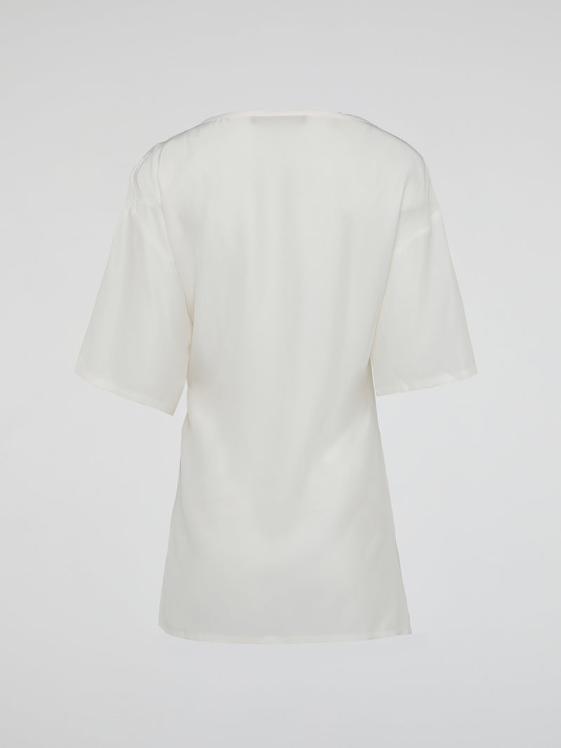 Elevate your wardrobe with the timeless elegance of the White Ruched Top by Roberto Cavalli. Crafted from luxurious fabric, this top features a flattering ruched design that accentuates your curves while adding a touch of sophistication to any outfit. Whether you're attending a glamorous event or a casual day out, this piece effortlessly exudes confidence and style, making it a must-have addition to your collection.