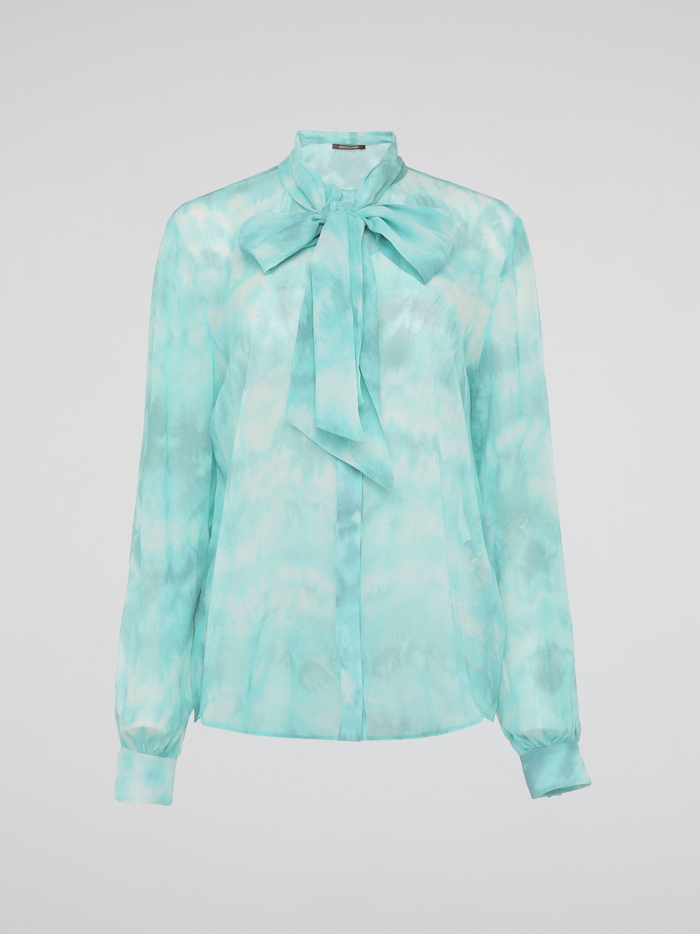 Embrace a vibrant and eco-friendly fashion statement with our Green Tie Dye Blouse by Roberto Cavalli. Crafted with exquisite attention to detail, this unique piece seamlessly combines the timeless elegance of a blouse with the bold and playful allure of tie-dye. Whether you're strolling through a music festival or elevating your everyday style, this blouse promises to make a head-turning statement, while embracing sustainable fashion.