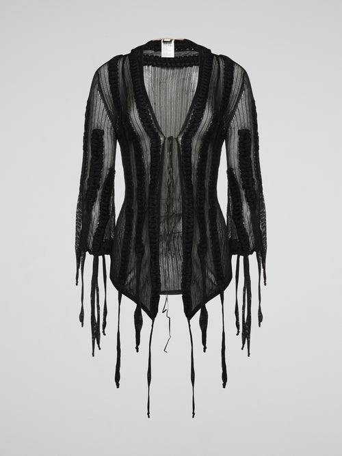 Wrap yourself in luxurious style with the Roberto Cavalli Black Mesh Cardigan. Made from lightweight, breathable mesh fabric, this cardigan is perfect for layering year-round. The intricate black mesh design adds a touch of edgy sophistication to any outfit.