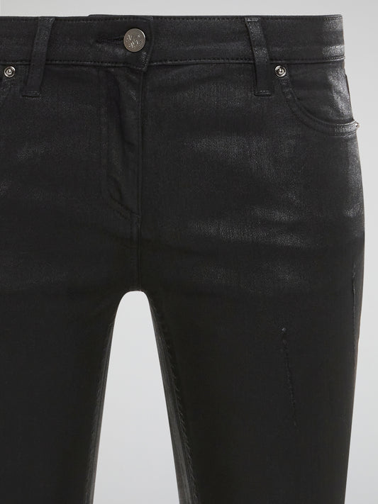 Step into edgy sophistication with Roberto Cavalli's Black Distressed Skinny Jeans. These sleek denim bottoms feature a subtle worn-in look with distressed detailing for a modern twist on a classic style. Elevate your outfit with these statement-making jeans that exude cool confidence and undeniable luxury.