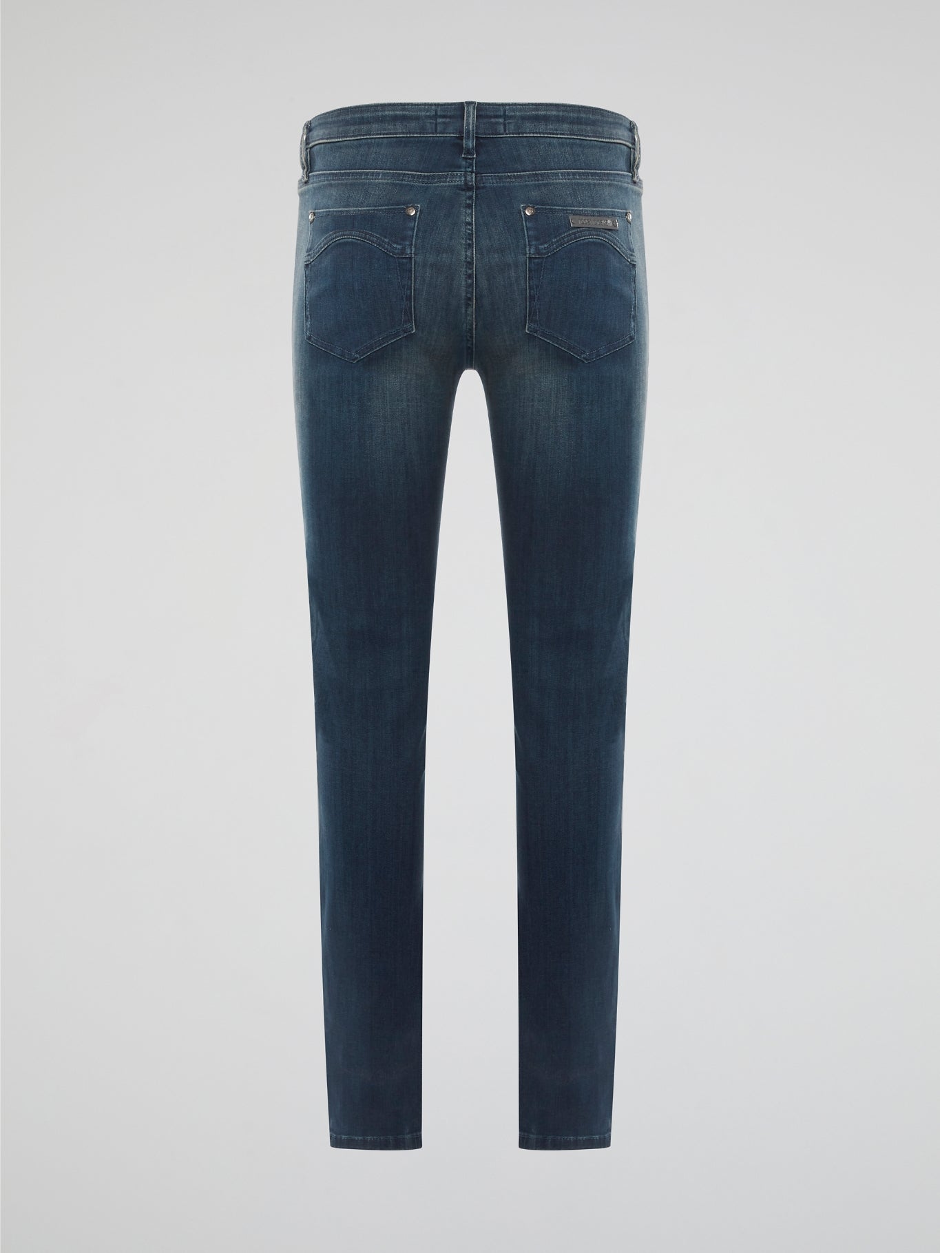 Elevate your denim game with these Stone Washed Skinny Denim Jeans by Roberto Cavalli, designed to hug your curves in all the right places. The unique stone wash finish gives these jeans a worn-in, vintage look that sets them apart from your average pair of skinny jeans. Pair them with a sleek blouse and heels for a chic and edgy urban look that will turn heads wherever you go.