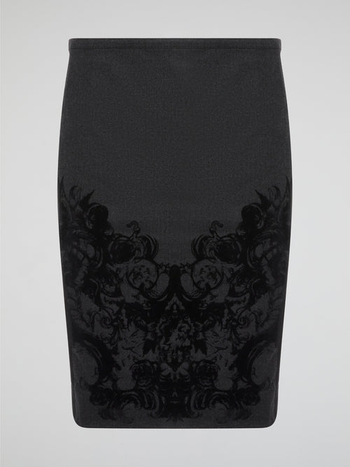 Elevate your office attire with this stunning grey printed pencil skirt from iconic designer Roberto Cavalli. The intricate pattern adds a touch of sophistication and style, making you stand out from the crowd. Pair it with a crisp white blouse and heels for a polished and fashion-forward look that will turn heads wherever you go.