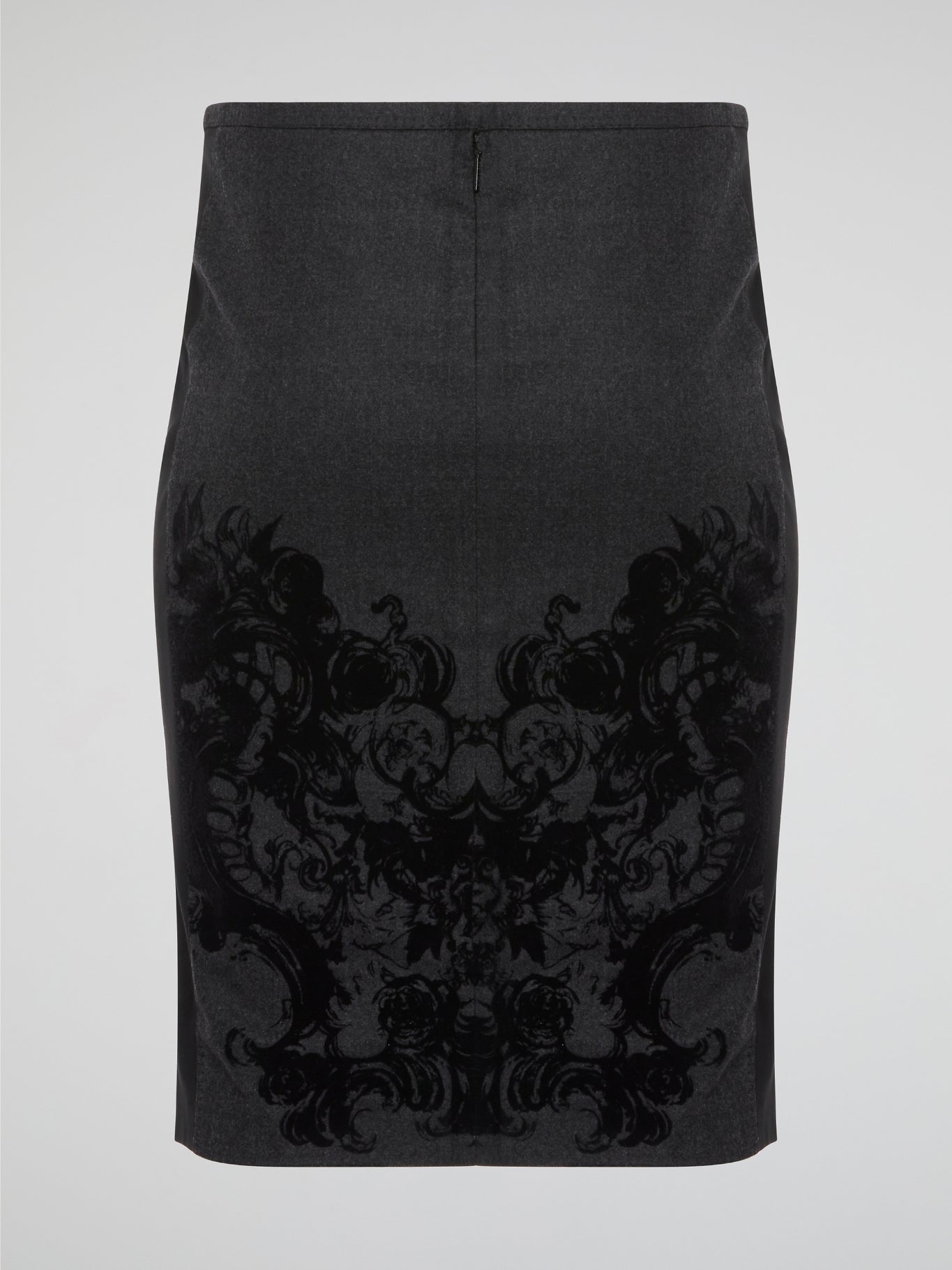 Elevate your office attire with this stunning grey printed pencil skirt from iconic designer Roberto Cavalli. The intricate pattern adds a touch of sophistication and style, making you stand out from the crowd. Pair it with a crisp white blouse and heels for a polished and fashion-forward look that will turn heads wherever you go.