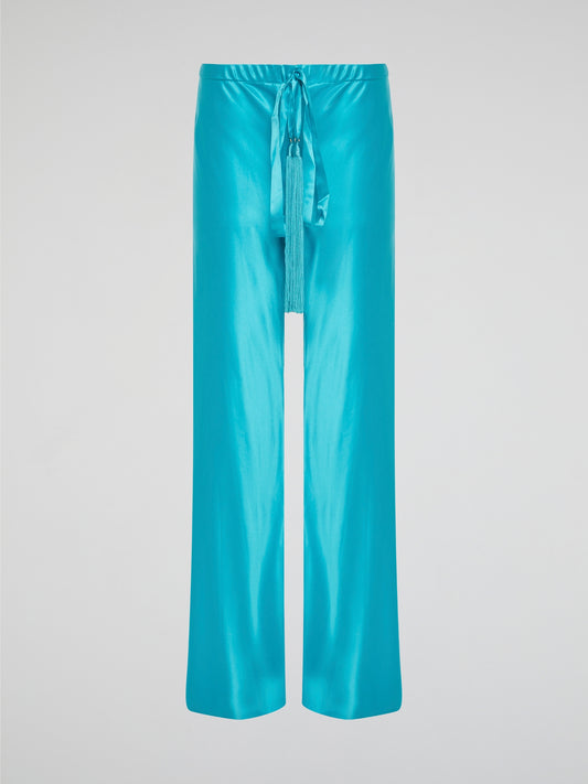 Step up your style game with these luxurious blue silk pants by Roberto Cavalli. The drawstring waist adds a casual and comfortable touch to the elegant silk fabric, making them perfect for any occasion. Stand out from the crowd and make a statement with these unique and eye-catching pants.