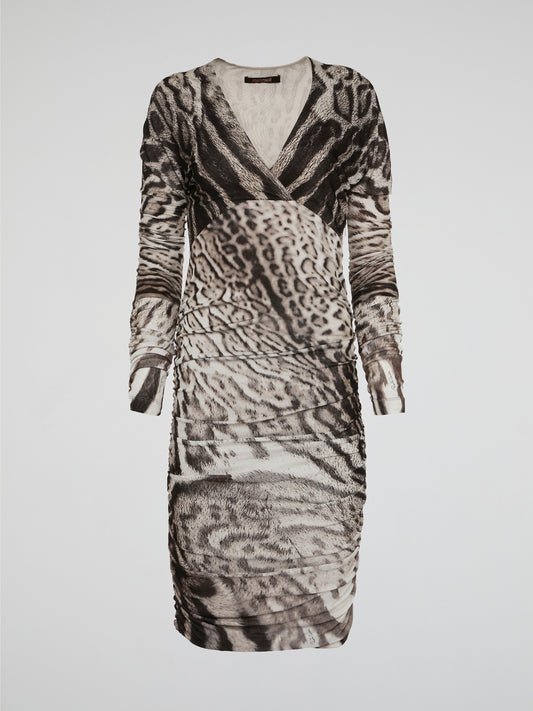 Unleash your wild side with the fierce Leopard Print Ruched Dress by Roberto Cavalli. This statement piece features a body-hugging silhouette and ruched detailing that accentuates your curves in all the right places. Whether you're out on the town or at a glamorous event, this dress is sure to turn heads and make a bold fashion statement.