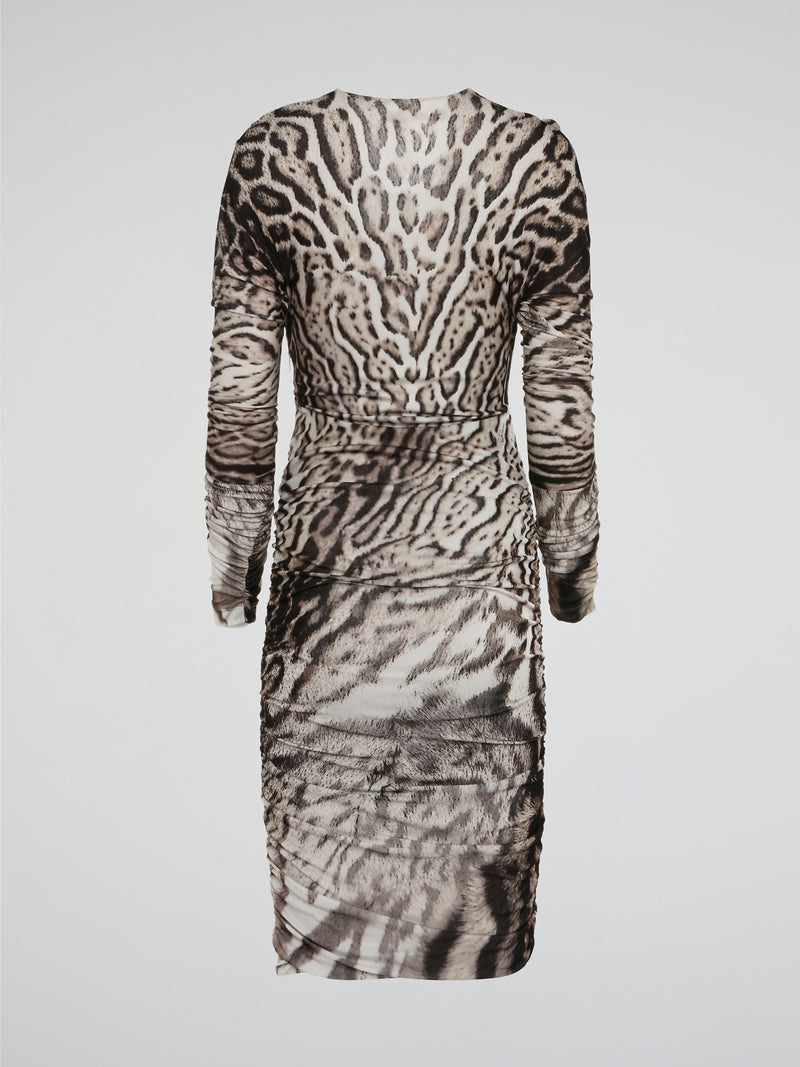 Unleash your wild side with the fierce Leopard Print Ruched Dress by Roberto Cavalli. This statement piece features a body-hugging silhouette and ruched detailing that accentuates your curves in all the right places. Whether you're out on the town or at a glamorous event, this dress is sure to turn heads and make a bold fashion statement.