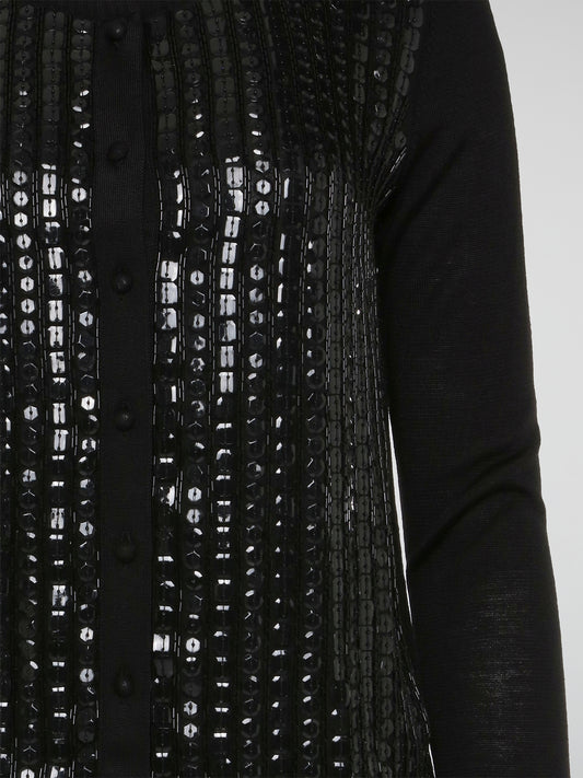 Wrap yourself in luxurious style with this Black Embroidered Cardigan from Roberto Cavalli. Featuring intricate embossed detailing that adds a touch of glamour to any outfit, this cardigan is perfect for layering in the cooler months. Elevate your wardrobe with this statement piece that is sure to turn heads wherever you go.