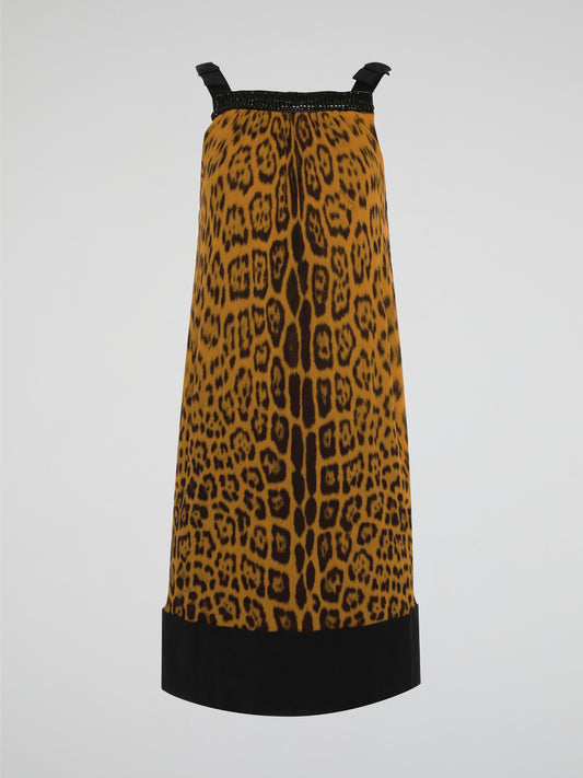 Step out in fierce style with our Brown Leopard Print Shift Dress by Roberto Cavalli. This stunning piece features a bold leopard print design in rich shades of brown, guaranteed to turn heads wherever you go. Made with high-quality materials and expert craftsmanship, this dress is the perfect choice for making a statement at any event.