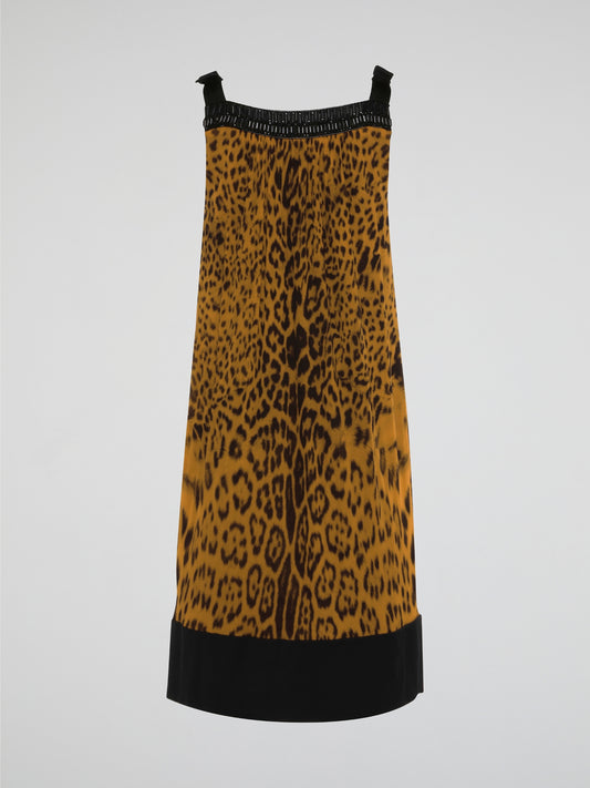 Step out in fierce style with our Brown Leopard Print Shift Dress by Roberto Cavalli. This stunning piece features a bold leopard print design in rich shades of brown, guaranteed to turn heads wherever you go. Made with high-quality materials and expert craftsmanship, this dress is the perfect choice for making a statement at any event.