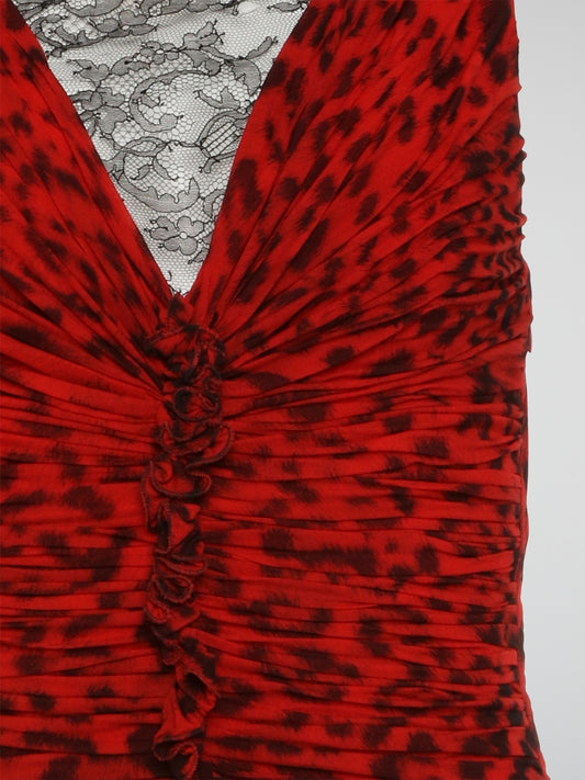 Make a fierce statement with this red leopard print ruched dress from Roberto Cavalli. The bold animal print pattern combined with the flattering ruched detailing creates a stunning and eye-catching look. Perfect for a night out or special event, this dress will make you stand out from the crowd in style.
