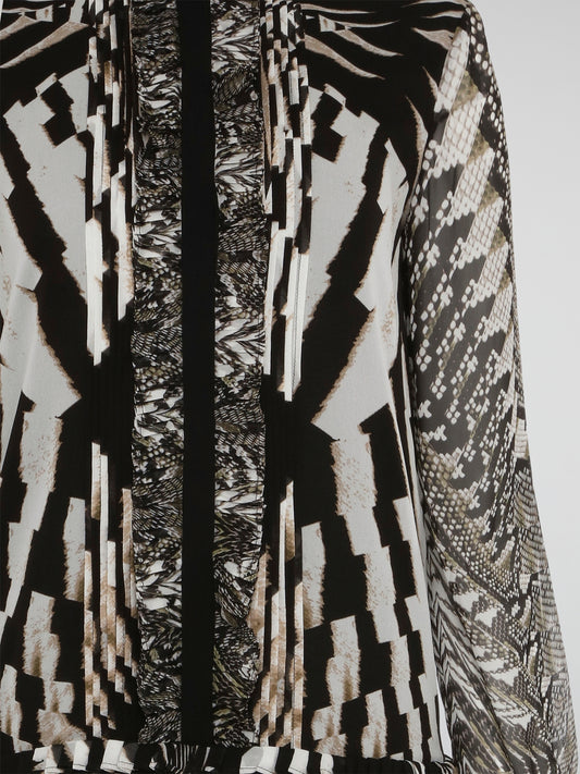 Step into the wild side of fashion with the Animal Print Pleated Shirt Dress by Roberto Cavalli. Designed to turn heads, this dress features a striking animal print pattern and flirty pleated skirt. This statement piece is perfect for those who dare to stand out and embrace their fierce style.