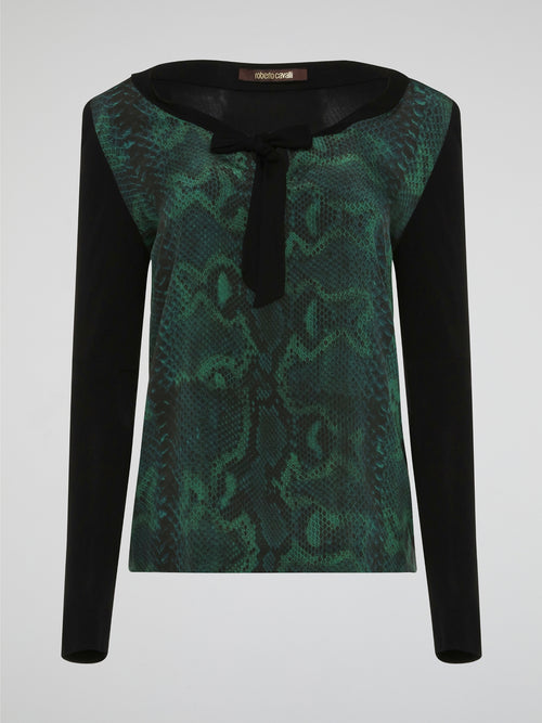Embrace your wild side with the Reptilian Long Sleeve Top by Roberto Cavalli. Made from luxurious, soft fabric, this top features a mesmerizing reptile print that will turn heads wherever you go. With its chic and edgy design, this top is the perfect statement piece to elevate any outfit.