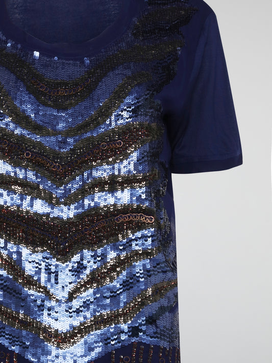 Shimmer and shine your way through any occasion in the Navy Oversized Sequin Top by Roberto Cavalli. This stunning piece features cascading sequins in a rich navy hue that will make you stand out from the crowd. Elevate your wardrobe with this glamorous top that exudes luxury and sophistication.