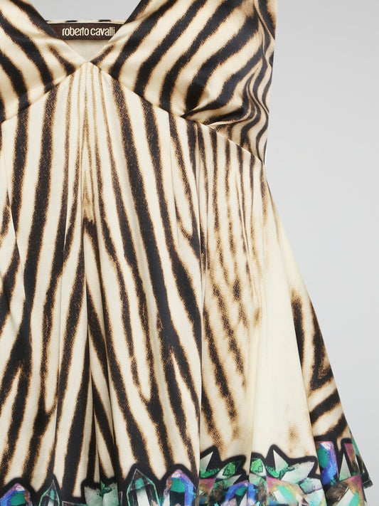 Embrace your wild side with this fierce Animal Print Flared Top by Roberto Cavalli. The bold print and flowy silhouette will make you stand out in any crowd, while the luxurious fabric ensures comfort all day long. Pair it with sleek black pants or rock it with denim for a versatile and stylish look that is sure to turn heads.