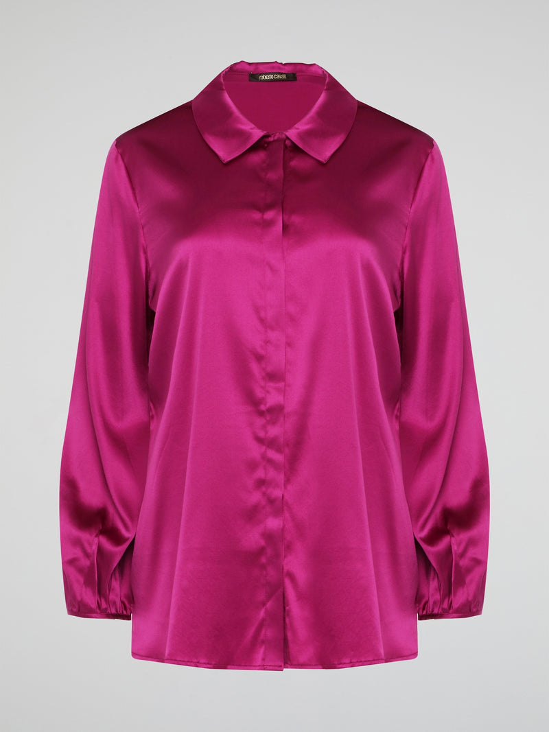 Elevate your wardrobe with this exquisite Pink Long Sleeve Silk Shirt by Roberto Cavalli. Crafted from luxurious silk fabric, this shirt drapes beautifully on the body, creating a sophisticated silhouette. The vibrant pink hue adds a pop of color to any outfit, making it the perfect statement piece for any occasion.