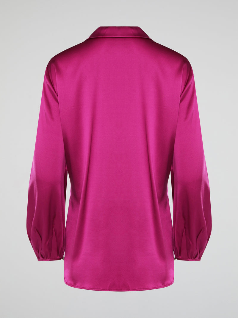 Elevate your wardrobe with this exquisite Pink Long Sleeve Silk Shirt by Roberto Cavalli. Crafted from luxurious silk fabric, this shirt drapes beautifully on the body, creating a sophisticated silhouette. The vibrant pink hue adds a pop of color to any outfit, making it the perfect statement piece for any occasion.