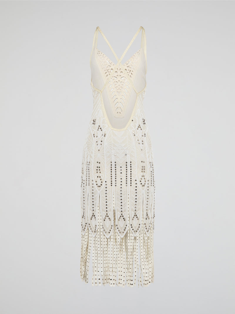 Step out in style in this stunning White Embroidered Fringe Dress from iconic designer Roberto Cavalli. The intricate embroidery detailing and playful fringe trim add a touch of bohemian elegance to this timeless piece. Whether you're hitting the beach or attending a summer soirée, this dress is sure to turn heads and make a statement.