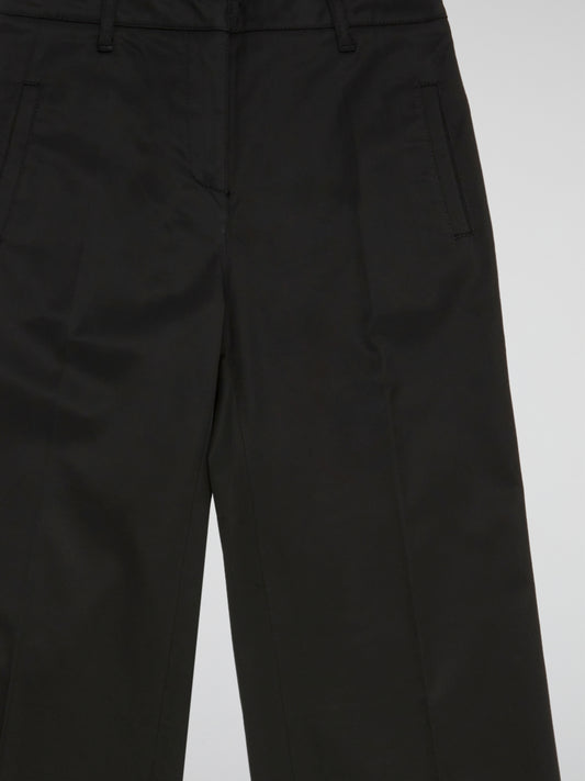 Step up your style game with these sleek and sophisticated Black Straight Leg Trousers by Blumarine. Crafted from premium quality fabric, these trousers are designed to flatter your figure and provide all-day comfort. Perfect for work or a night out, these versatile trousers will have you looking effortlessly chic and stylish.