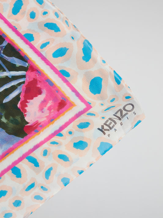 Wrap yourself in vibrant elegance with the Floral Print Scarf from Kenzo. This luxurious accessory features a stunning floral motif that adds a pop of color to any outfit. Crafted from sumptuously soft fabric, this scarf is a must-have for those who appreciate both style and comfort.