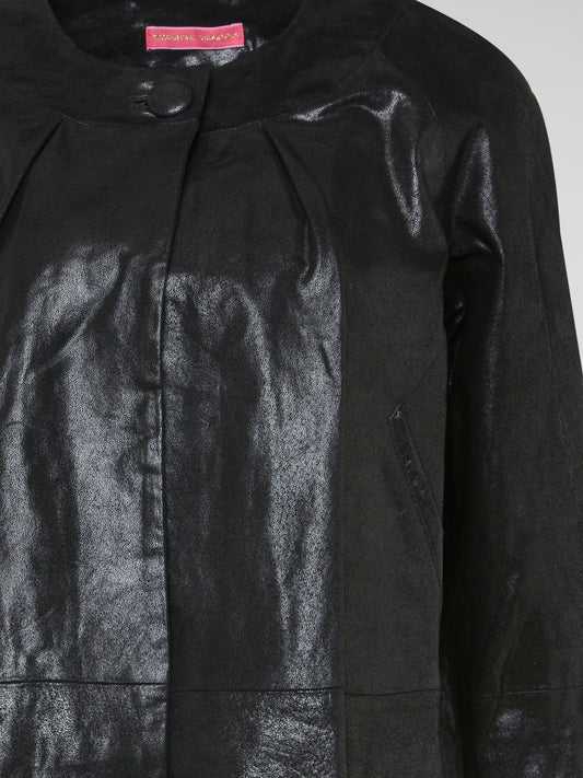 Step out in style with the Black Leather Coat from Charlotte Tarantola. Crafted from luxurious leather, this coat is a statement piece that exudes confidence and sophistication. The perfect addition to any wardrobe, this coat will elevate any outfit and have you turning heads wherever you go.
