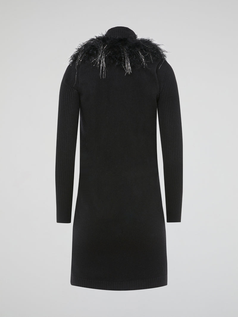 Step out in style and turn heads in our luxurious Black Faux Fur Sweater Dress by Blumarine. This fierce and fabulous dress features a soft faux fur exterior that will make you feel like a true fashionista. Whether you're hitting the town or cozying up at home, this dress is sure to make a statement and keep you warm all season long.