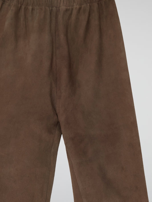 Indulge in luxurious comfort with our Brown Suede Trousers by Max And Moi - the epitome of chic sophistication. Crafted from the finest quality suede, these trousers offer a sleek silhouette and a touch of textural elegance. Elevate your everyday look with this statement piece that seamlessly transitions from day to night.