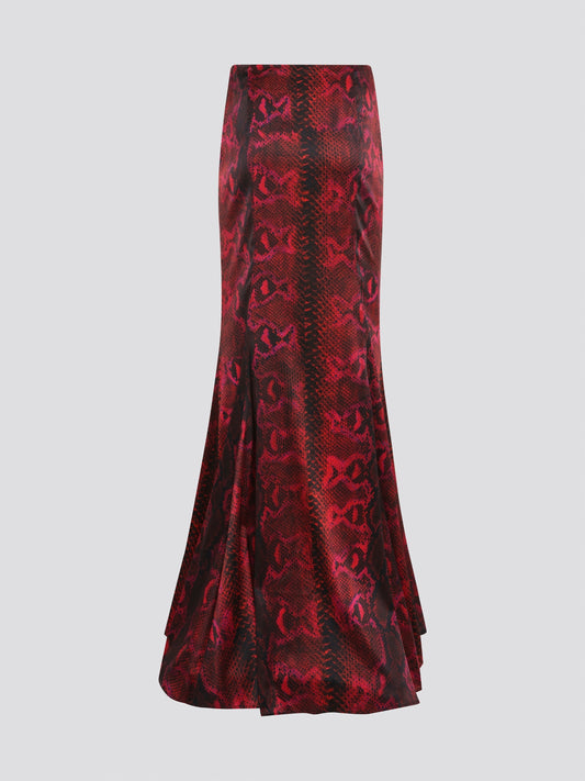 Make a fierce fashion statement with the Red Snake Print Draped Skirt by Roberto Cavalli. This bold and exotic piece features a striking snake print design that will turn heads wherever you go. The draped silhouette adds a touch of drama and sophistication, making it the perfect choice for a night out on the town.