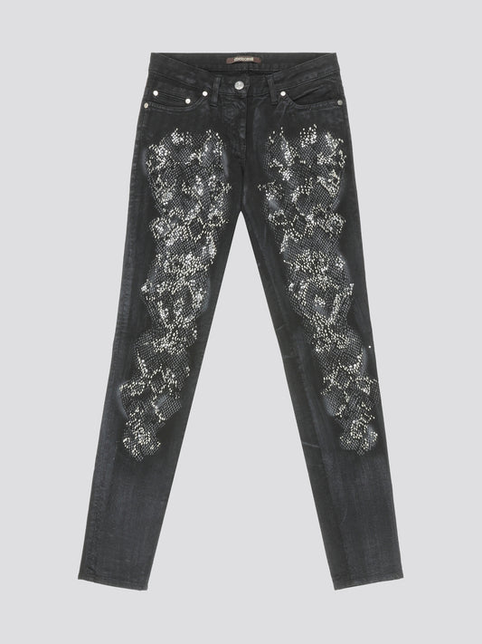 Step into the spotlight with these Grey Crystal Embellished Jeans by Roberto Cavalli, where luxury meets edgy sophistication. The intricate crystal detailing adds a touch of glamour to your everyday denim, ensuring you stand out from the crowd. Elevate your street style and add a touch of sparkle to your wardrobe with these statement jeans.