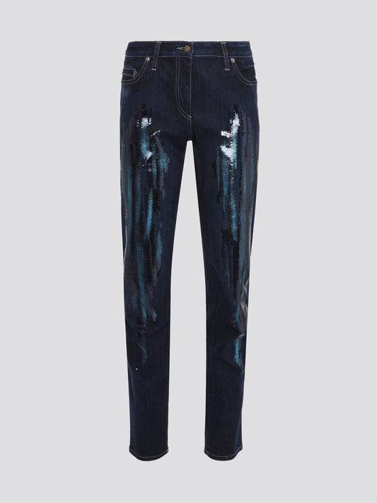 Turn heads in these mesmerizing Navy Sequin Detailed Jeans by Roberto Cavalli. With intricate sequin embellishments adorning the pockets and sides, these jeans are a show-stopping piece for any occasion. Step out in style and sparkles with these statement-making jeans that are sure to make you stand out from the crowd.